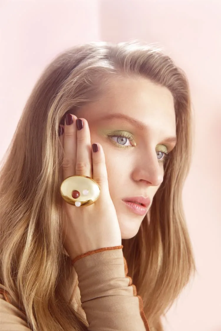 gold cocktail ring with stones